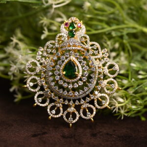 "A close-up of a sparkling CZ Diamond pendant with a gold setting. The pendant features a large, pear-shaped CZ Diamond in the center, surrounded by smaller diamonds in a delicate design." CZ Diamond