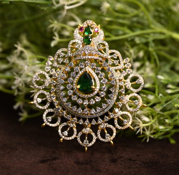 "A close-up of a sparkling CZ Diamond pendant with a gold setting. The pendant features a large, pear-shaped CZ Diamond in the center, surrounded by smaller diamonds in a delicate design." CZ Diamond