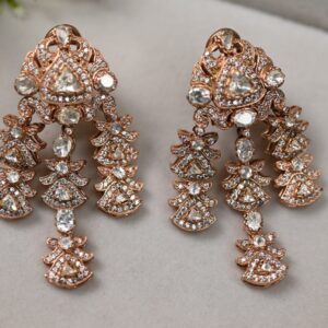 The image shows a pair of stunning rose gold chandelier earrings. The earrings feature multiple strands of sparkling moissanites, creating a cascading effect. The intricate design and the brilliance of the moissanites make these earrings a true showstopper. The rose gold setting adds a touch of warmth and elegance to the overall look.