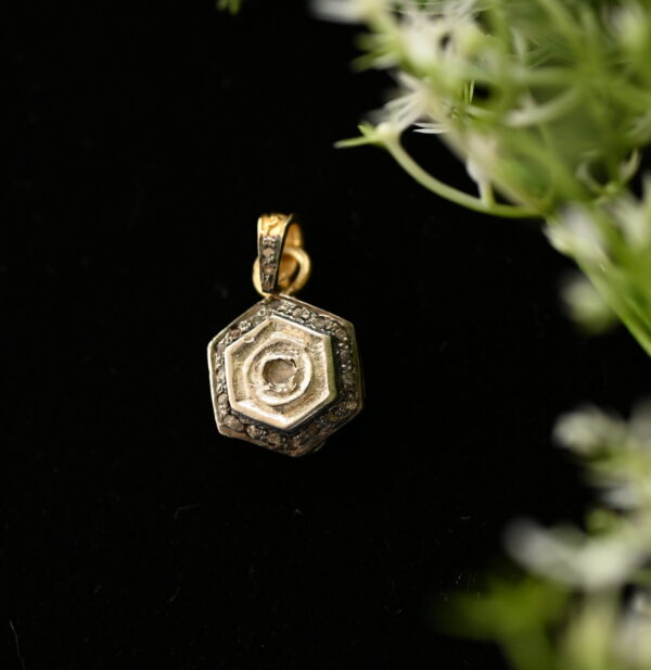 This image features a necklace crafted from rough-cut diamonds and delicate pave settings. The rough-cut diamonds, with their natural facets and irregular shapes, add a unique and organic touch to the design. The pave setting, which consists of tiny, closely set diamonds, creates a shimmering band of light that complements the rough-cut stones. The necklace is made of silver, which enhances the brilliance of the diamonds.