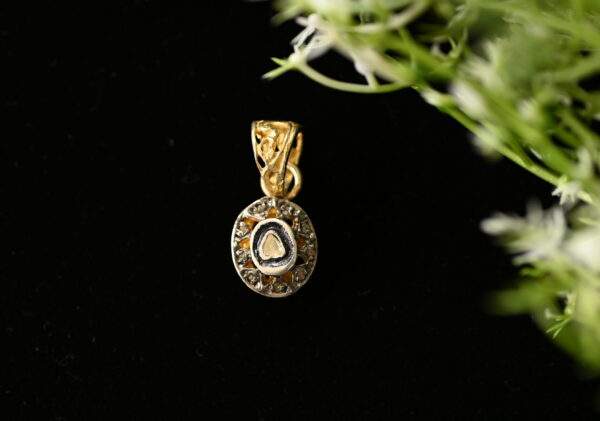 The image showcases a delicate and elegant diamond pendant crafted from 925 sterling silver. The pendant features a circular design with a central, bezel-set diamond. Surrounding the central diamond is a halo of smaller diamonds, creating a shimmering and eye-catching effect. The pendant hangs from a thin chain, likely also made of 925 sterling silver. The background appears to be black, providing a stark contrast and highlighting the brilliance of the diamonds.