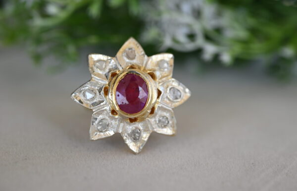 The image showcases a unique and captivating ring, likely a cocktail ring, crafted with exquisite artistry.