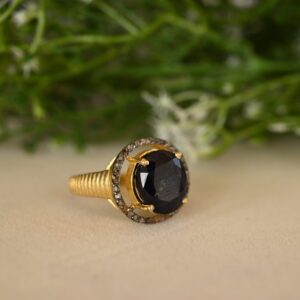 This stunning ring features a captivating black onyx gemstone encircled by a halo of sparkling diamonds. Sterling Silver Diamond Ring