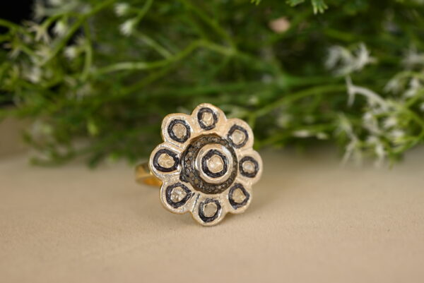 The image is taken from a slightly elevated angle, allowing us to see the details of the ring's design. The background is blurred, which helps to draw attention to the ring itself.