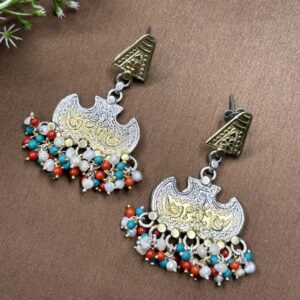 The image provides a clear view of the earrings from multiple angles, highlighting the intricate details and design elements. The background of the image is a neutral color, which helps to draw attention to the earrings and their intricate details.