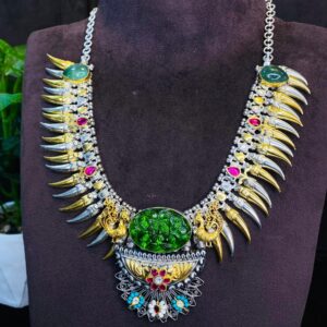 The image quality is good, allowing for a clear view of the necklace's details. The background appears to be dark, which helps to highlight the necklace's colors and textures.