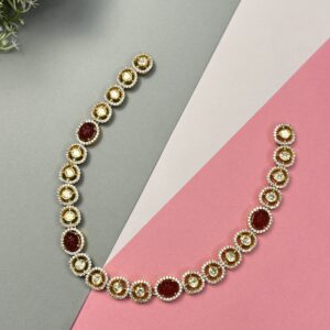 The image shows a necklace with alternating round moissanites and oval-shaped red gemstones. The necklace is laid out on a multi-colored background, with a red rosebud in the top left corner. 925 Silver