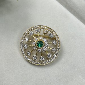 The image shows a close-up of an elegant gold pendant. The pendant has an oval shape and features a central, round-cut moissanite stone. Surrounding the center stone is a halo of smaller moissanites, creating a dazzling display of sparkle. The pendant's design is further enhanced by intricate filigree work and a delicate border of smaller stones.