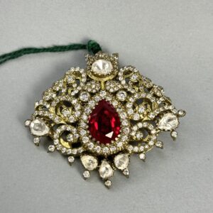 "A rectangular moissanite pendant with a large ruby in the center and surrounded by smaller diamonds." "A close-up of a vintage-style pendant with a ruby and diamond embellishments." Unique Pendant