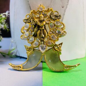 The image showcases a necklace with a captivating pendant. The necklace appears to be crafted from gold or a gold-toned metal, adding to its luxurious feel. The pendant is the centerpiece, drawing the eye with its intricate design and sparkling embellishments.