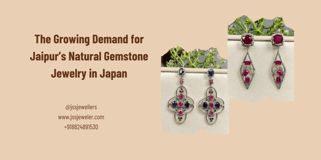 "A promotional banner featuring the text 'The Growing Demand for Jaipur’s Natural Gemstone Jewelry in Japan' in bold brown font on a beige background. Below, contact details for JSS Jewellers are displayed, including their Instagram handle (@jssjewellers), website (www.jssjeweler.com), and phone number (+918824891530). On the right side, two images of intricately designed gemstone earrings are shown against a white background with green plant elements. The earrings include silver-toned metalwork with ruby, sapphire, and diamond-like stones in elegant, symmetrical patterns."